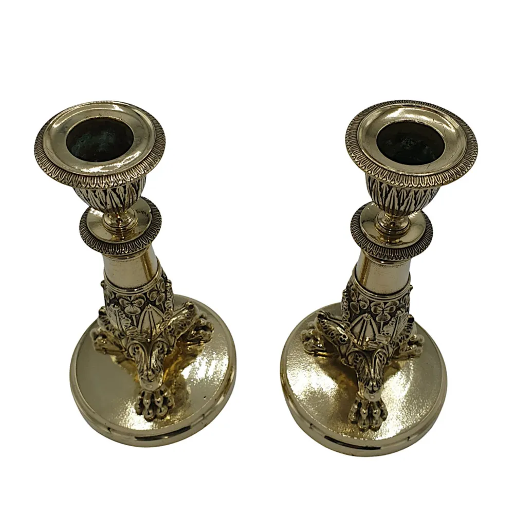  A Beautiful Pair of 19th Century Empire Style Polished Brass Candlesticks