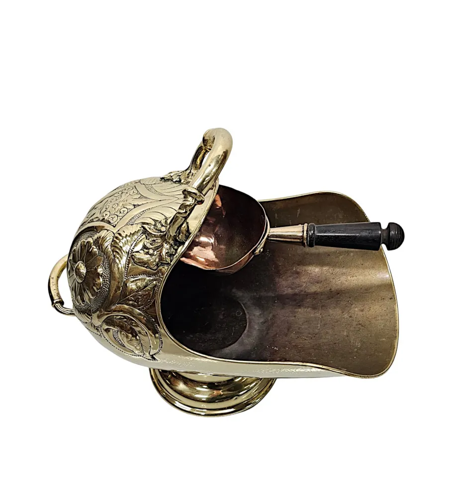 A Stunning 19th Century Embossed Polished Brass Helmet Coal Scuttle with Shovel