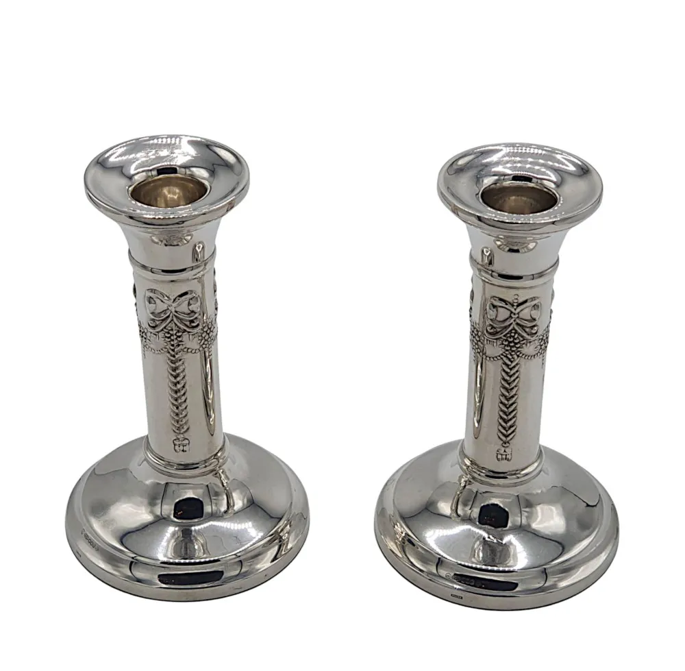 A Lovely Pair of 20th Century Sterling Silver Candlesticks after Adams