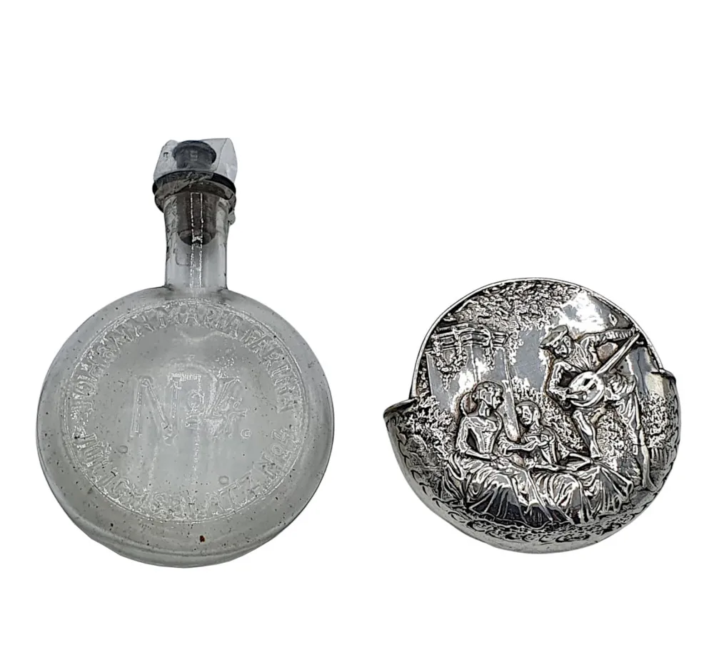 An Exquisite 19th Century Sterling Silver Bottle Holder and Perfume Bottle