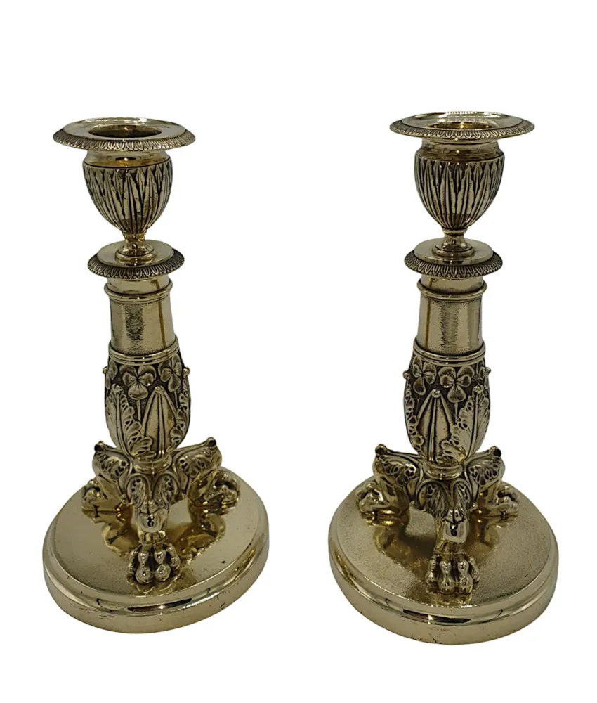  A Beautiful Pair of 19th Century Empire Style Polished Brass Candlesticks