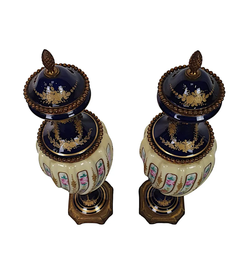 A Lovely Quality Pair of 19th Century Urns in the manner of Sevres