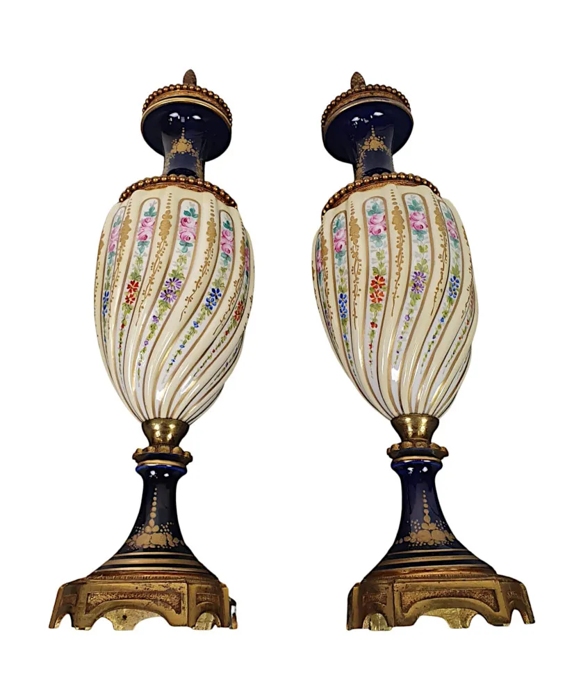 A Lovely Quality Pair of 19th Century Urns in the manner of Sevres