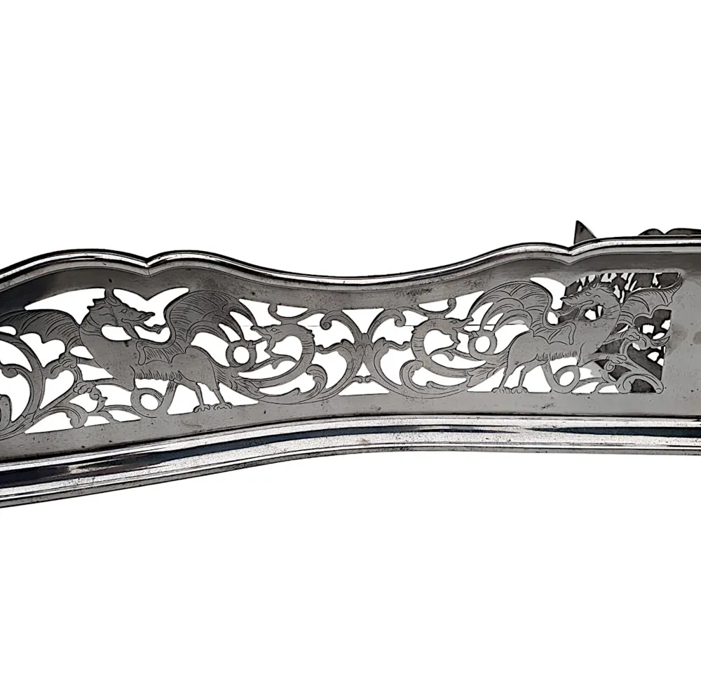 A Rare 19th Century Polished Steel Fender with Flower and Dragon Detail