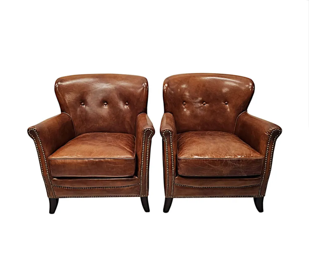  A Stunning Pair of Small Leather Club Armchairs in the Art Deco Style 
