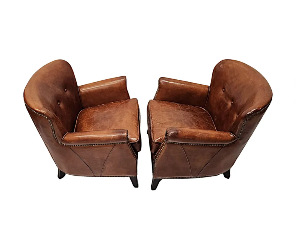  A Stunning Pair of Small Leather Club Armchairs in the Art Deco Style 