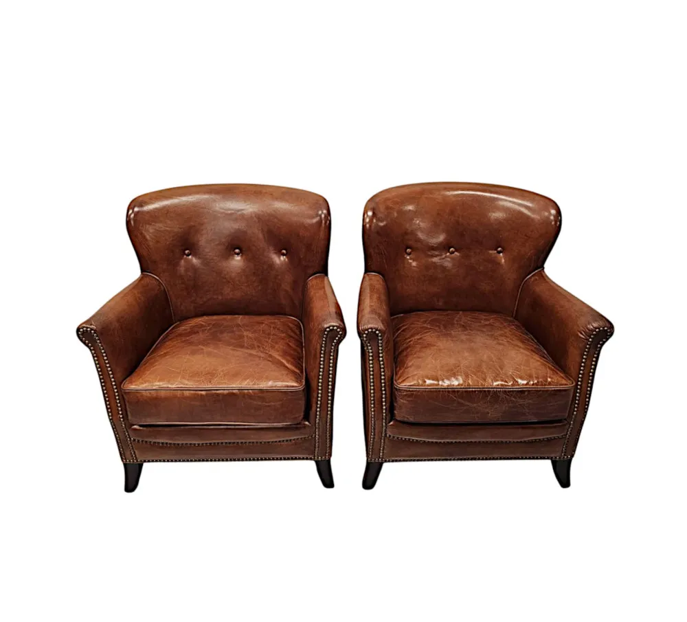  A Stunning Pair of Small Leather Club Armchairs in the Art Deco Style 