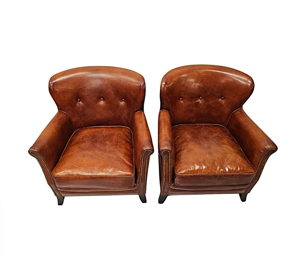  A Stunning Pair of Small Leather Club Armchairs in the Art Deco Style 