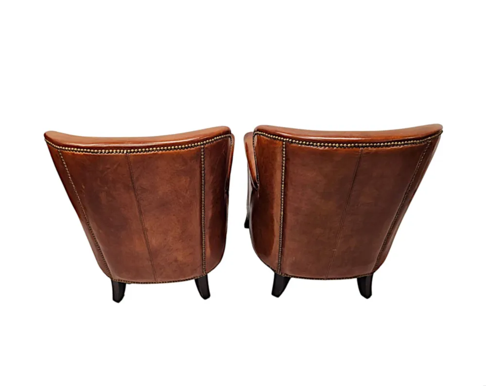  A Stunning Pair of Small Leather Club Armchairs in the Art Deco Style 