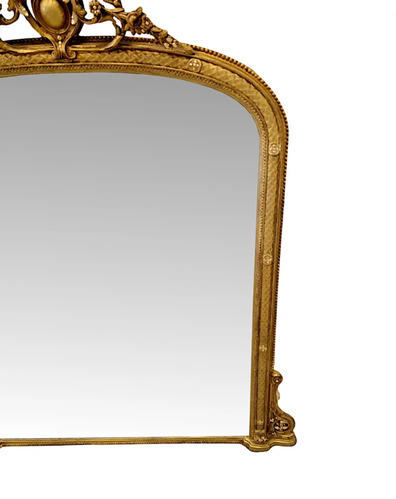  A Fabulous 19th Century Giltwood  Archtop Overmantel Mirror with Central Cartouche