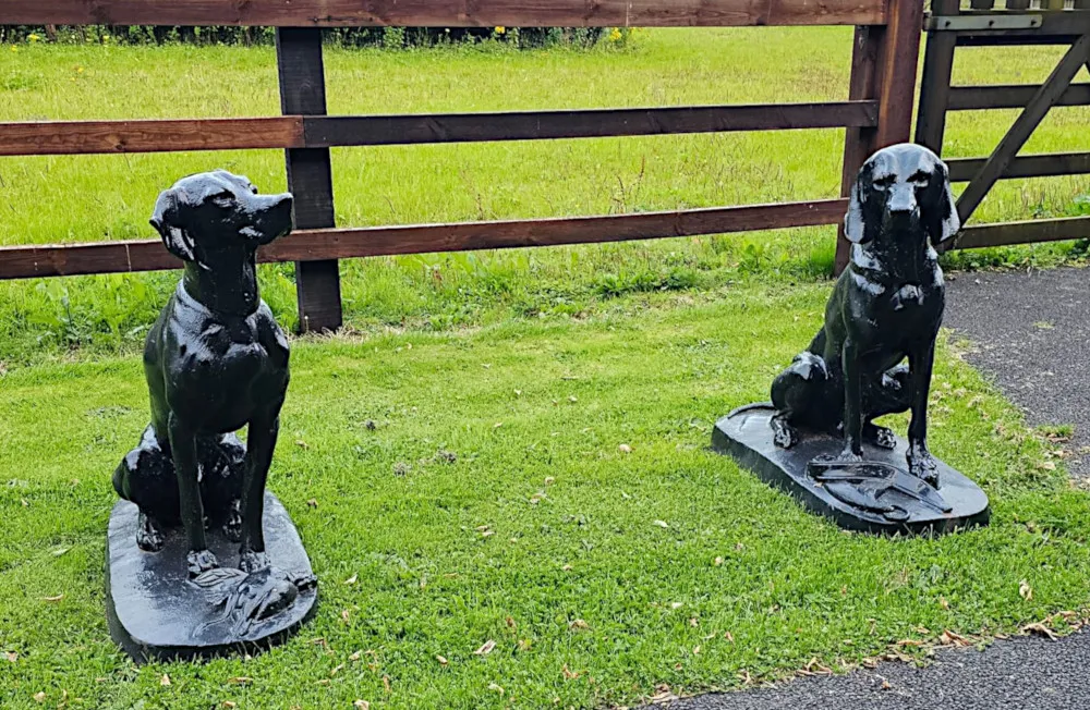 A Rare Pair of 20th Century Animalier Cast Iron Hunting Dogs