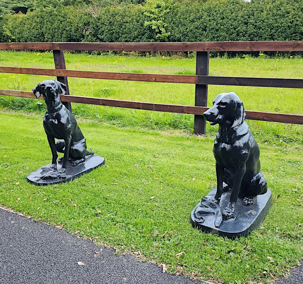 A Rare Pair of 20th Century Animalier Cast Iron Hunting Dogs