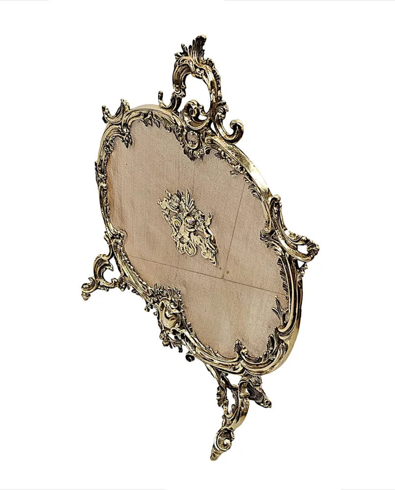 A Gorgeous 19th Century Polished  Brass Fire Screen in the Rococco Design with Cherub Detail