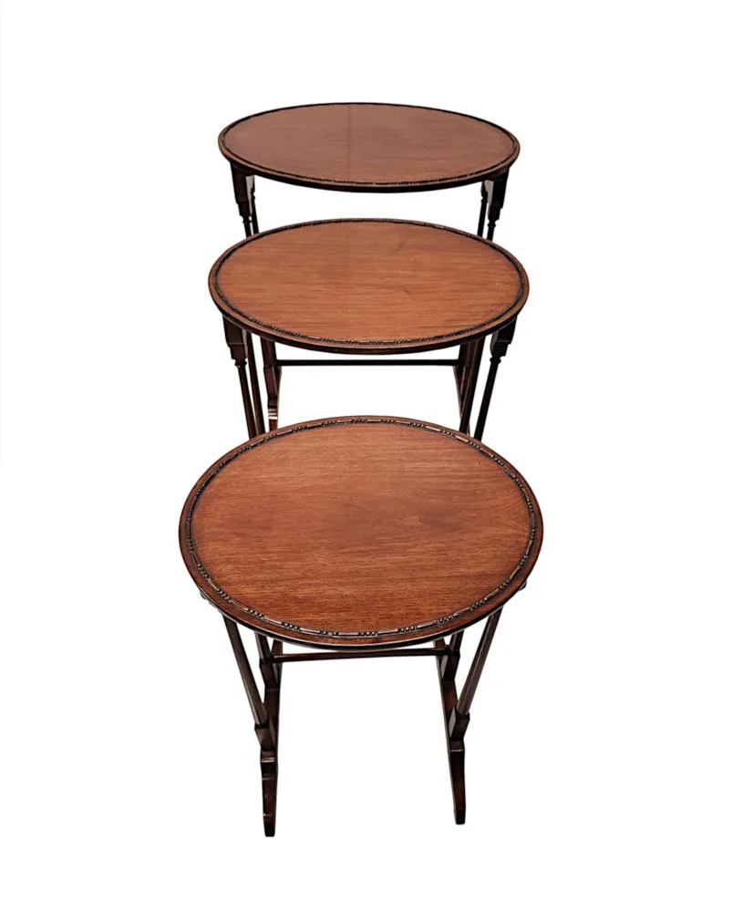 A Very Fine Edwardian Nest of Three Oval Tables