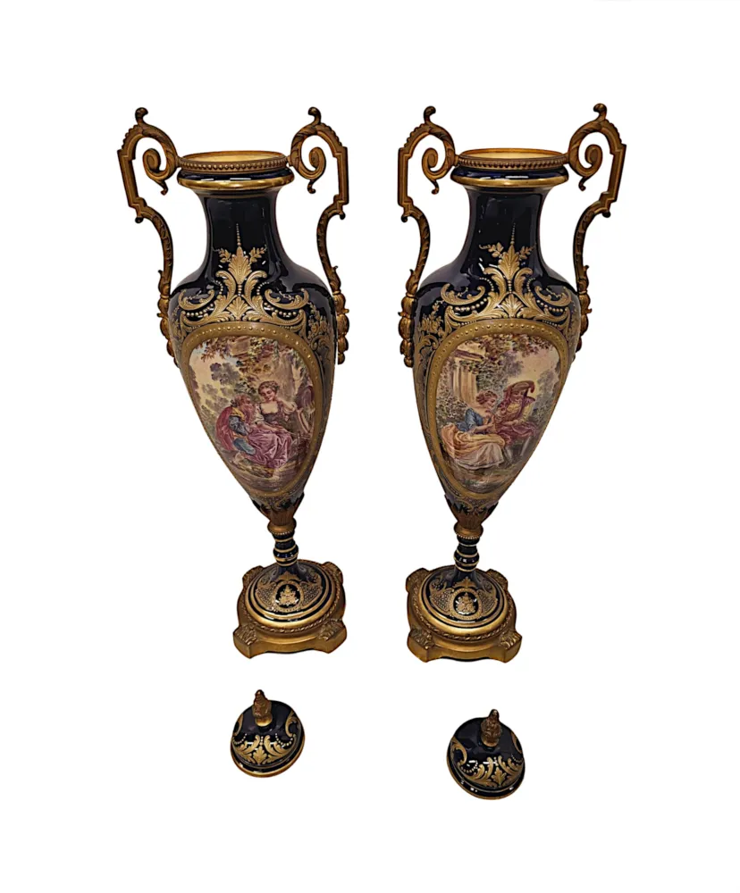 A Very Rare Pair of 19th Century French Hand Painted Sevres Style Urns with Ormolu Mounts