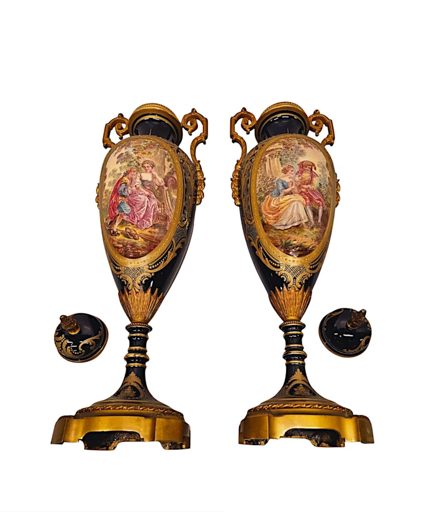 A Very Rare Pair of 19th Century French Hand Painted Sevres Style Urns with Ormolu Mounts