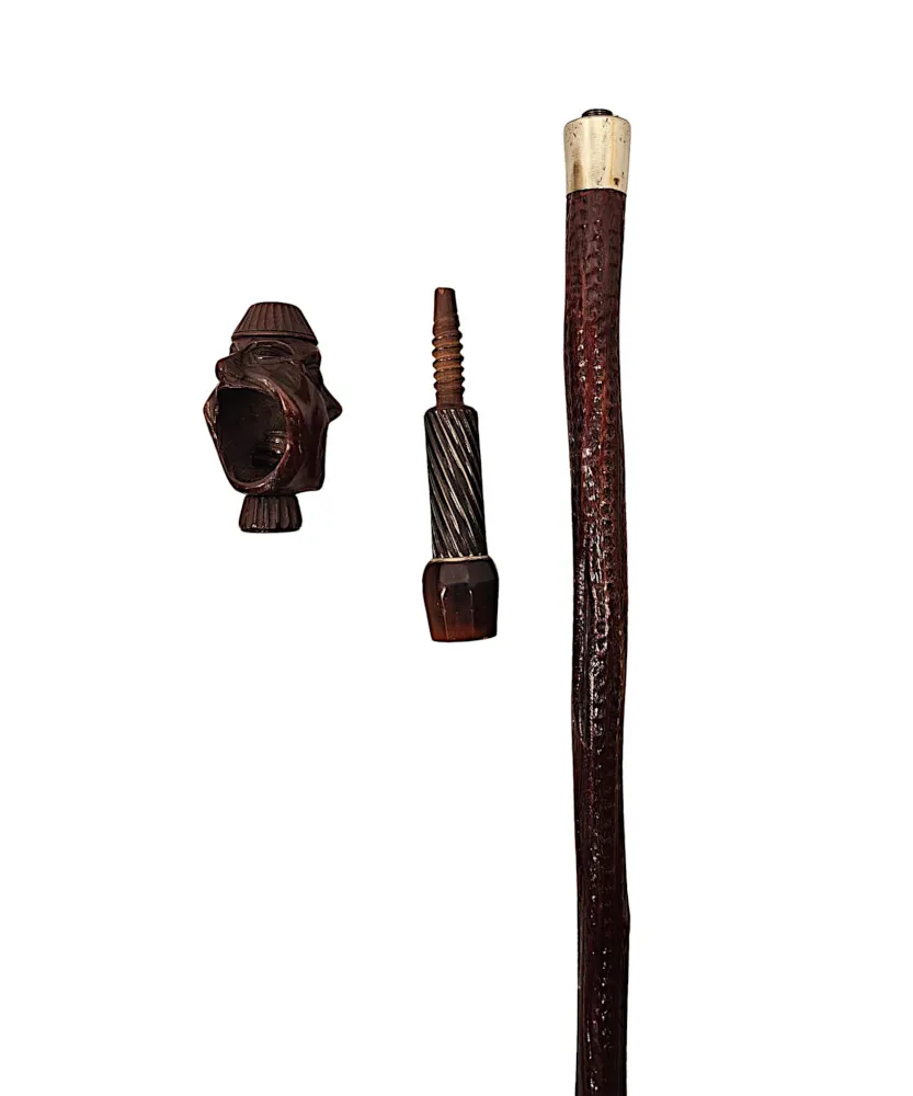 A Very Rare 19th Century Gadget Nut Cracker Walking Cane with a Pair of Carved Heads