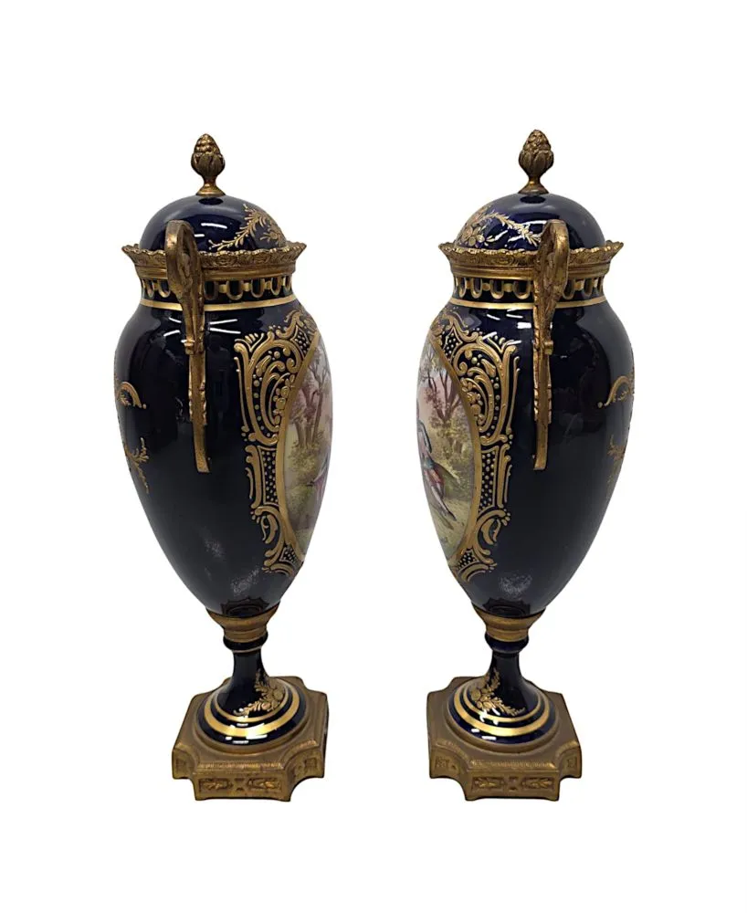  A Very Fine Pair of 19th Century Hand Painted Sevres Style Lidded Urns
