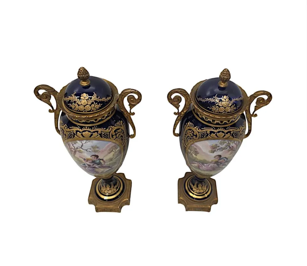  A Very Fine Pair of 19th Century Hand Painted Sevres Style Lidded Urns