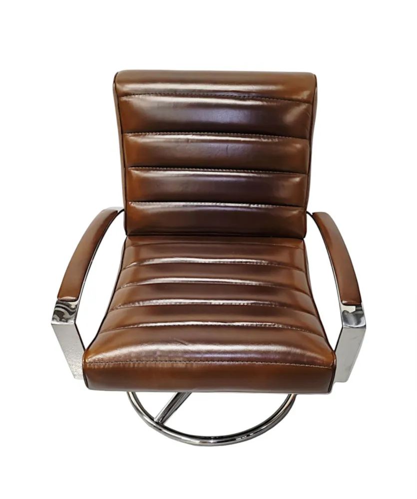  A Stunning Mid Century Style Leather and Chrome Revolving Armchair