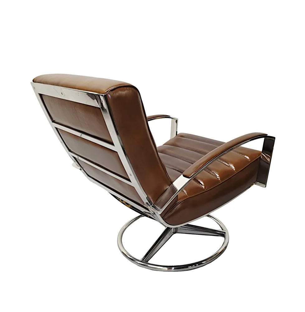  A Stunning Mid Century Style Leather and Chrome Revolving Armchair