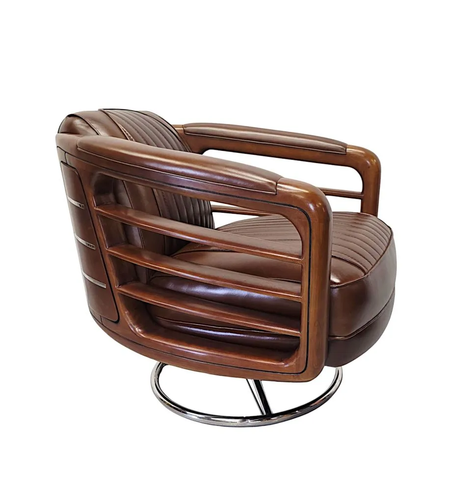 A Fabulous Handmade Walnut and Chrome Revolving Leather Armchair