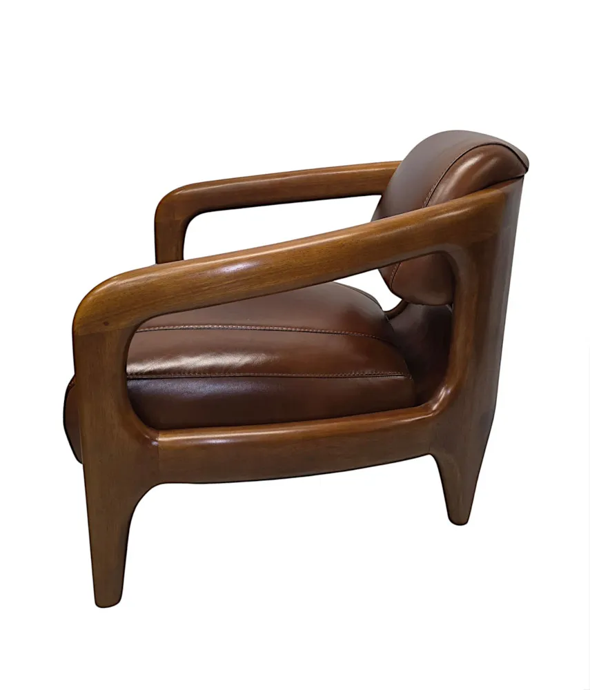 A Fabulous Mid Century Design Walnut and Leather Armchair